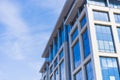 Crystal Reflections: A Building Facade of Grey Granite and Shimmering Glass Panels