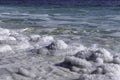 Crystal salt on a rock near beach in the Dead Sea. Israel
