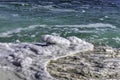 Crystal salt on a rock near beach in the Dead Sea. Israel