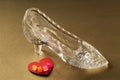 Crystal shoe and red heart with the word love Royalty Free Stock Photo