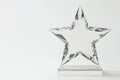 Crystal star on a light background. Space for text. Royalty Free Stock Photo