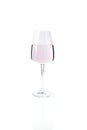 A crystal wine glass of pink liquid with a slight reflection on the surface. Glassware against the white background. Used in Royalty Free Stock Photo