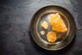 Crystalline grape sugar on a tin plate