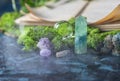 Crystalline minerals for meditation, moss, book. Magic Rock for Healing stones. Minerals for relaxation Royalty Free Stock Photo