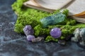 Crystalline minerals for meditation, moss, book. Magic Rock for Healing stones. Minerals for relaxation Royalty Free Stock Photo