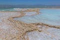 Crystallized salt cover the beach of Dead Sea in Israel