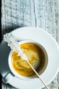 Crystallized sugar on wooden stick and coffee cup. Royalty Free Stock Photo
