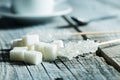 Crystallized sugar on wooden stick and sugar cubes. Royalty Free Stock Photo