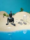 Crystals and buddha statuette miniature landscape Royalty Free Stock Photo