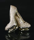 Crystals encrusted gold shoes Royalty Free Stock Photo