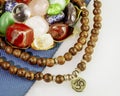 Crystals gemstones set with rosary beads on yoga mat