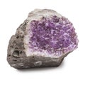 Crystals of lilac amethyst on a fracture of brown stone. Semiprecious stone