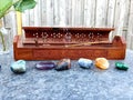 Crystals next to Incense Burner : CHAKR ASTONES  Polished Raw Lake Stones Gems River Water Rocks Royalty Free Stock Photo