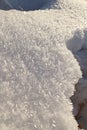 Crystals of snow near hole created by foot track Royalty Free Stock Photo