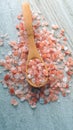 Himalaya pink salt in a wooden spoon Royalty Free Stock Photo