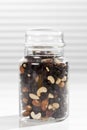 Variety of nuts and raisins in jar, close up. Royalty Free Stock Photo