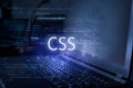 CSS inscription against laptop and code background. Technology concept. Learn programming language