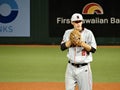 CSUN Pitcher prepares to pitch during a night game