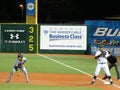 CSUN runner takes lead from 1st base with UH baseman holding base and umpire behind him Royalty Free Stock Photo