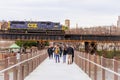 CSX Locomotive Engine pulling a coal and freight train on a bridge