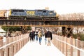 CSX Locomotive Engine pulling a coal and freight train on a bridge