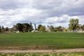 Cty golfcourse under cloudy sky Royalty Free Stock Photo