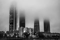 The Cuatro Torres Business Area in fog, Madrid Royalty Free Stock Photo