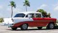 Cuba american red white Oldtimer parked on the road Royalty Free Stock Photo