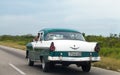 Cuba caribbean american classic car driver on the street