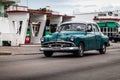 Cuba caribbean blue classic car drived on the street in havana