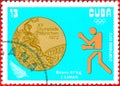Postage stamp printed in Cuba with a picture of a boxer and Olympic medal, with the inscription `Boxing, 67 kg`