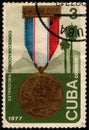 CUBA - CIRCA 1977: postal stamp 3 Cuban centavos printed by Republic of Cuba, shows Medal with ribbon