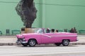 Cuba 10/12/2019 colourful old pink car used as taxi or transportation Royalty Free Stock Photo