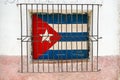 Cuba, Cuban flag behind a wrought iron gate in Havana Royalty Free Stock Photo
