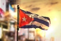 Cuba Flag Against City Blurred Background At Sunrise Backlight