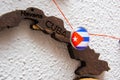 Cuba flag on the pin with red thread showed the paths on the wooden map.