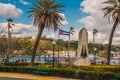 Cuba flag and statue of Jesus Christ on a hill overlooking the port and the bay of Havana. Royalty Free Stock Photo