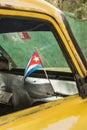 Cuba flag in yellow car