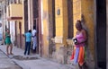 Cuba, Havana, February 10, 2018: poor women waiting outside their homes in the street Royalty Free Stock Photo