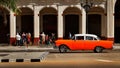 CUBA, HAVANA - JANUARY 16, 2019: Old American orange car in the old city of Havana Royalty Free Stock Photo