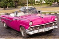 CUBA, HAVANA - MAY 5, 2017: American pink retro cabriolet on city street. Close-up.