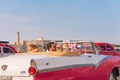 CUBA, HAVANA - MAY 5, 2017: American pink retro-cabriolet on the lighthouse background. Copy space for text. Close-up.