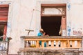 CUBA, HAVANA - MAY 5, 2017: Cuban man on the balcony. Copy space. Royalty Free Stock Photo