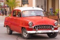 CUBA, HAVANA - MAY 5, 2017: Red American retro car on city street. Copy space for text. Ã¯Â¿Â½lose-up.