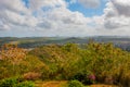 Cuba. Holguin: Top view of the city Holguin. Landscape with trees, mountains and houses in the distance.