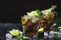 Cuba Libre with brown rum, cola, mint and lime. Cold Longdrink, alcohol cocktail. Royalty Free Stock Photo