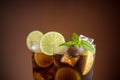 Cuba Libre cocktail. Alcoholic drink with cola, rum, lime and mint. Cuba Libre or long island iced tea cocktail.