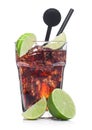 Cuba Libre Cocktail in glass with ice cubes and slices of lime with black straw and stirrer on white with raw limes Royalty Free Stock Photo