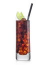 Cuba Libre Cocktail in highball glass with ice cubes and slices of lime with black straw on white