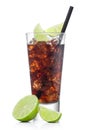 Cuba Libre Cocktail in luxury tall glass with ice cubes and slices of lime with black straw on white with raw limes Royalty Free Stock Photo